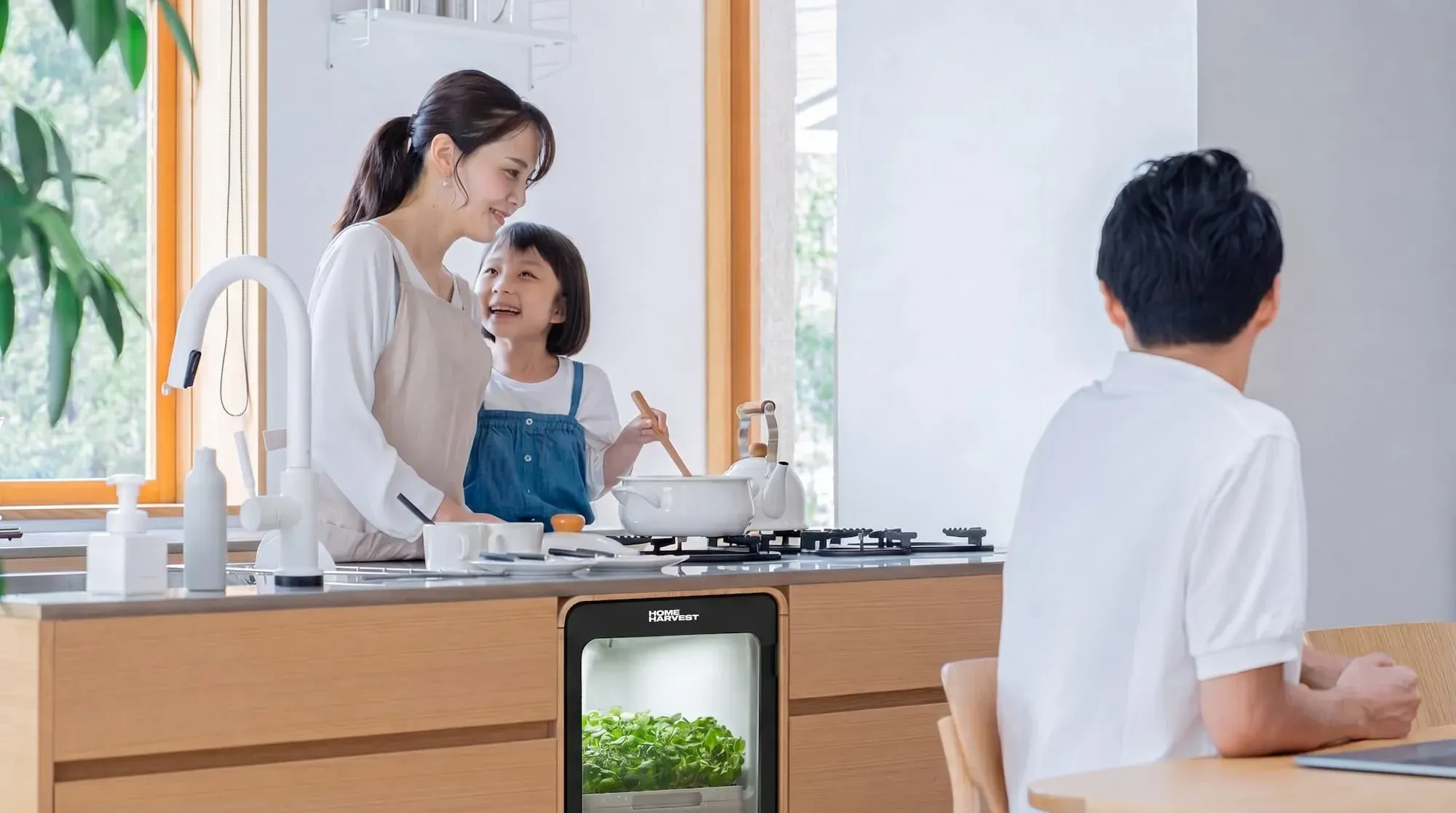 Mother and daughter preparing a meal with fresh salad